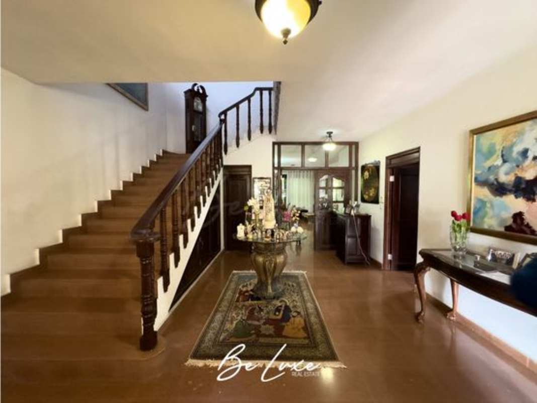 Spacious kitchen with wooden cabinets, granite countertops and island Altos del Golf Panama