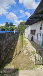 Concrete path, iron gate, metal roof rustic home Volcán Chiriquí Panama