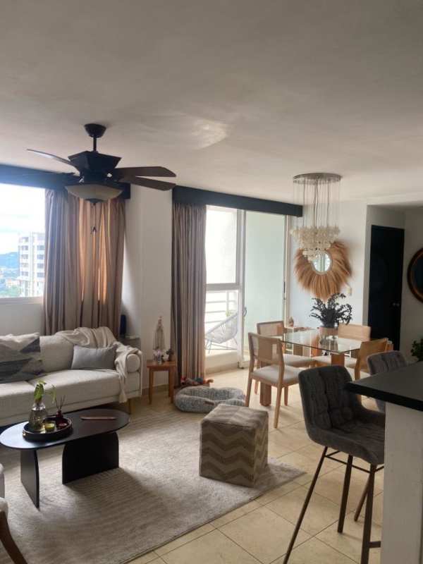 Open concept living and dining space with large windows and modern decor in PH Hato Pintado Tower Panama City