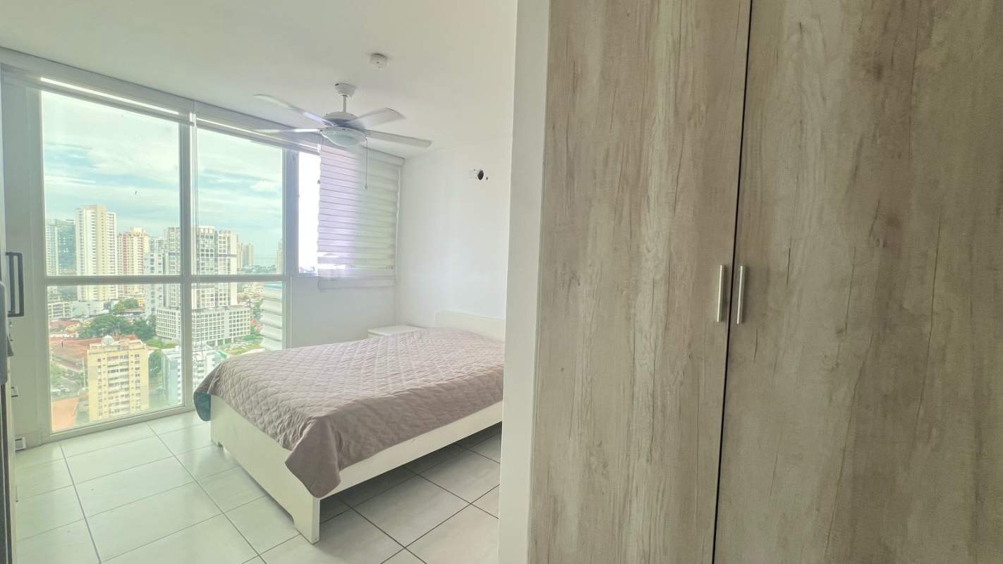 Rooftop swimming pool with skyline view and shaded lounge at PH Metropolitan Park Panama