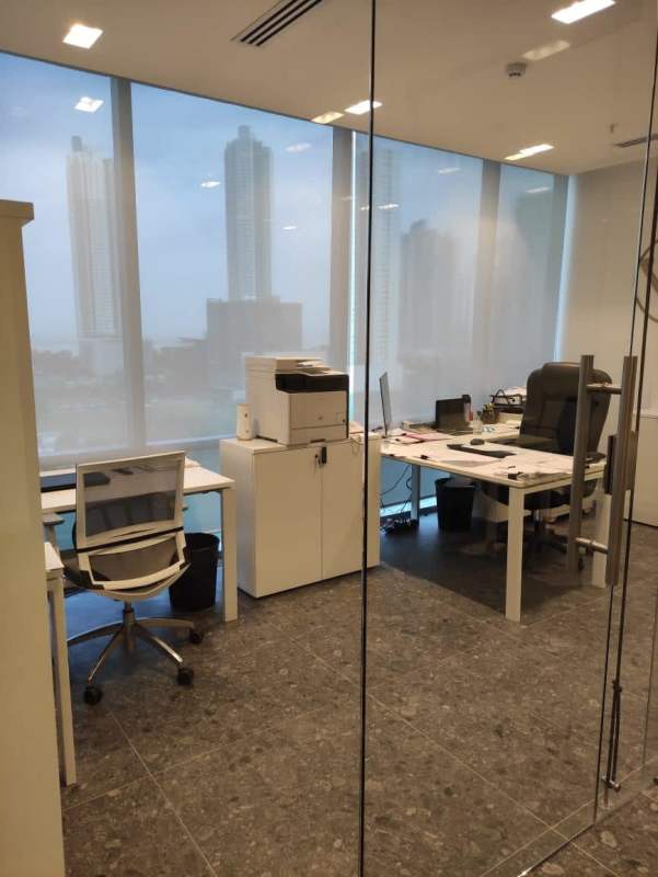 Modern office with floor to ceiling windows city skyline Costa del Este business district