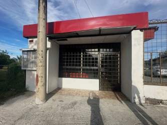 Vacant commercial retail interior with tiled floor and bright lighting in David Panama