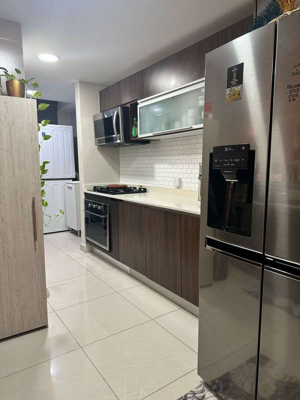 Bright living room with large panoramic windows and balcony in PH Genesis Tower San Francisco Panama