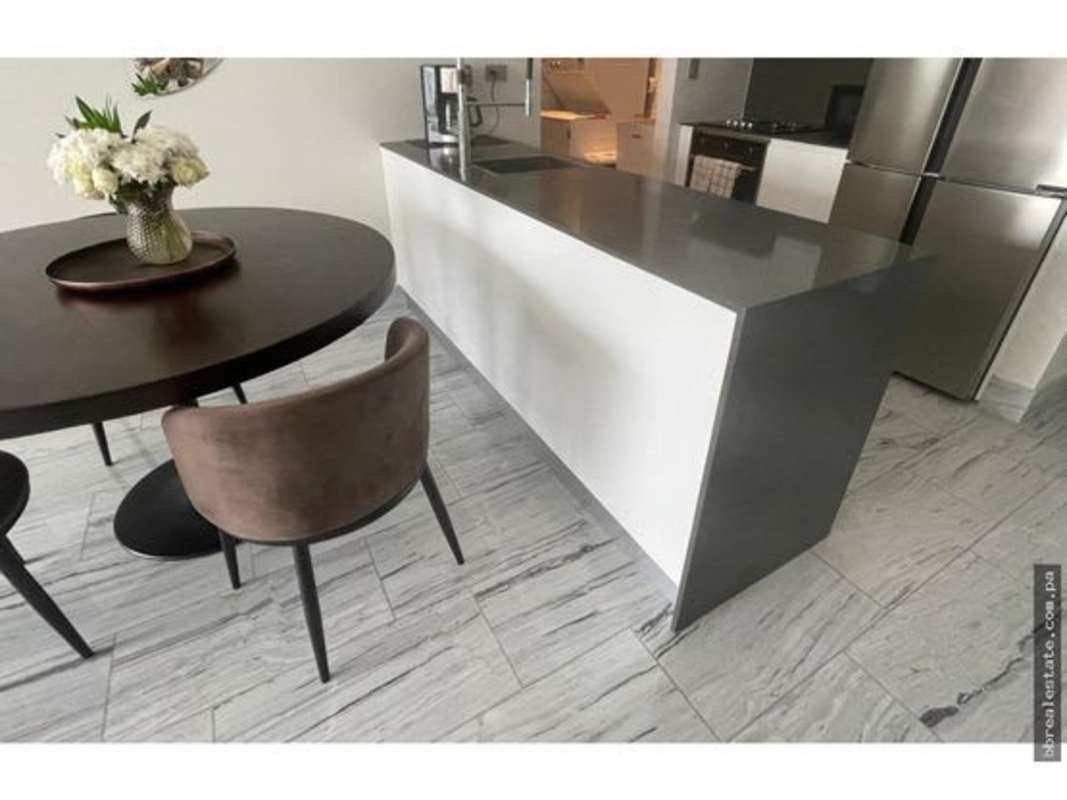 Spacious bedroom with modern decor and ocean skyline view in Nuovo by Armani Panama City