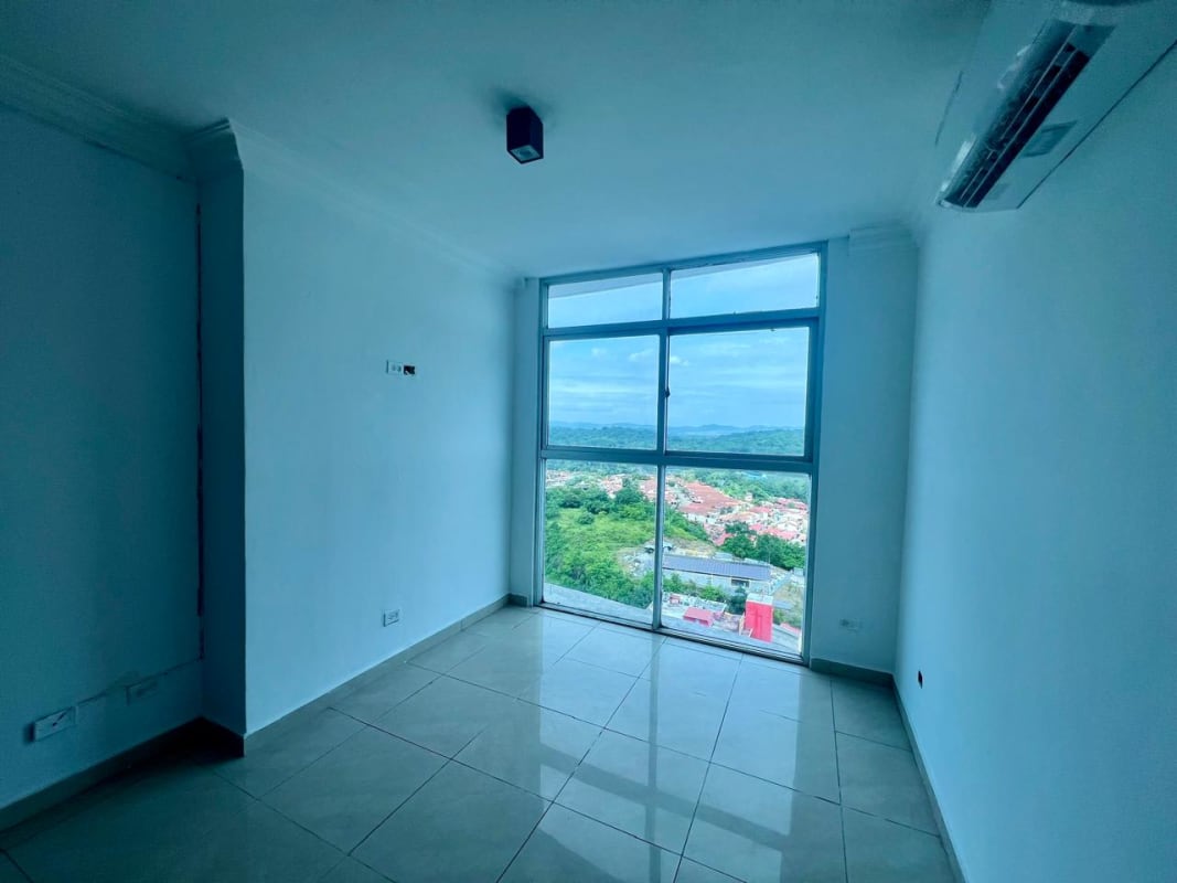 Secondary bedroom with built-in closet and large windows at PH Crystal Hills