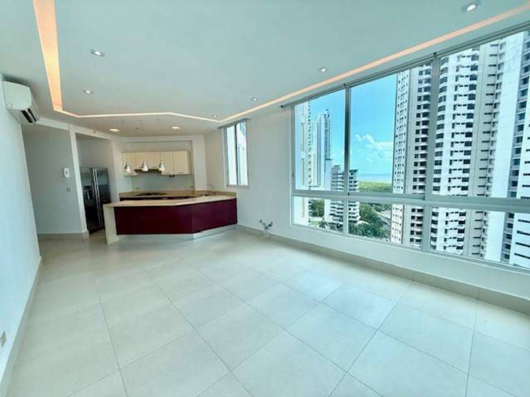 Modern living area with large windows overlooking ocean and city PH Castellammare Panama