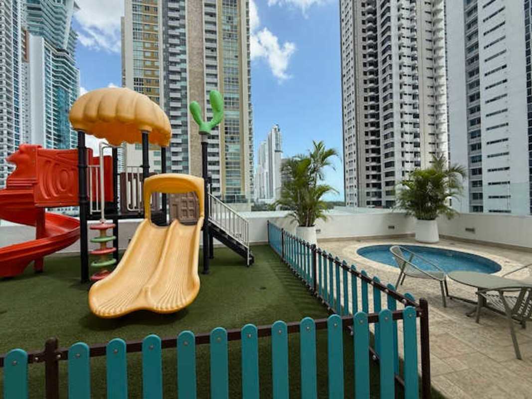 Swimming pool and sun deck with skyline backdrop at PH Castellammare Costa del Este