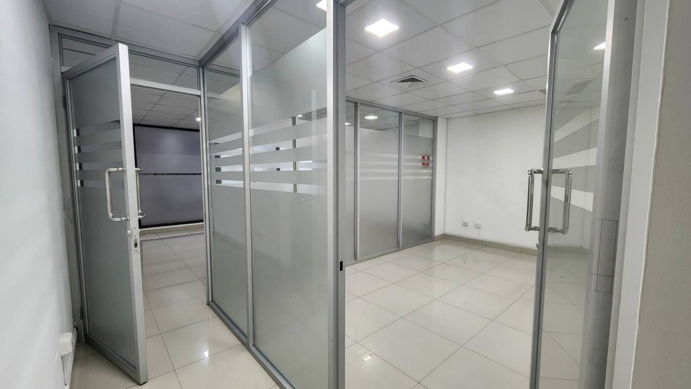 Empty glass partitioned office interior tiled floor PH Plaza Obarrio business complex Panama City