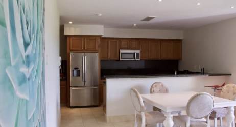 Large bedroom with natural light, closet space, neutral decor in Buenaventura beachfront condo Panama