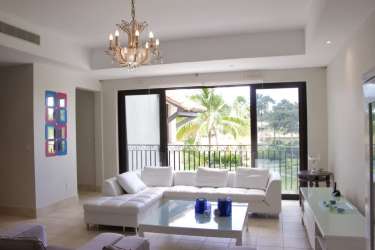 Bright master bedroom with access to terrace and views of gardens at Buenaventura Panama