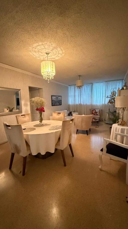 Kitchen with granite countertop, white cabinetry, stainless steel appliances in PH Crystal Tower Via Porras Panama