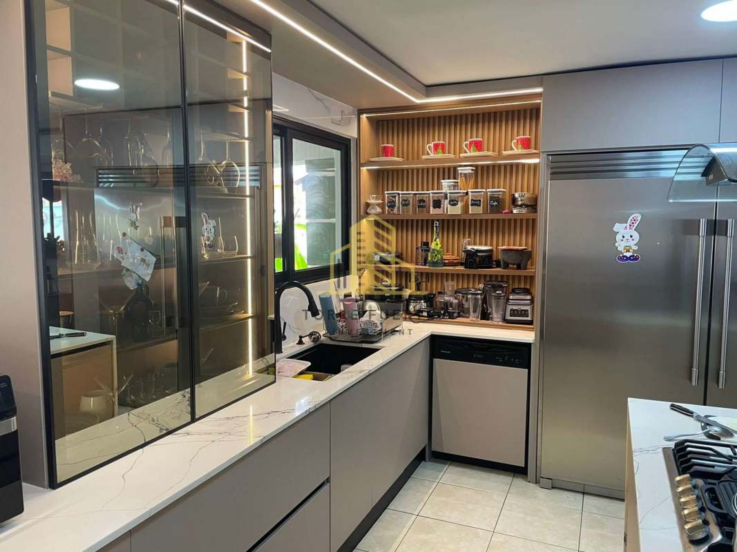 Outdoor terrace with seating area and bar next to swimming pool in Brisas del Golf Panama