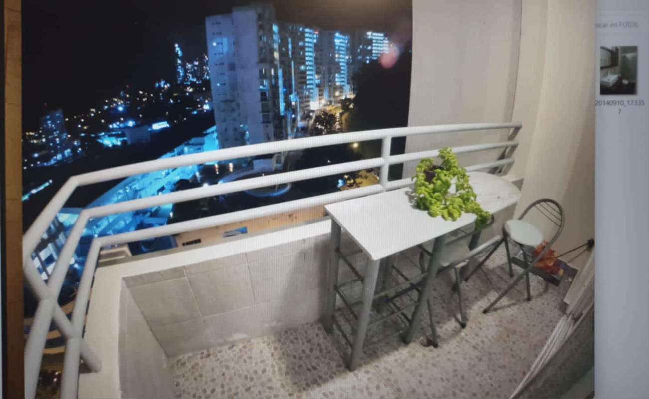City skyline night view from balcony with table and chairs in PH Majestic Garden Panama