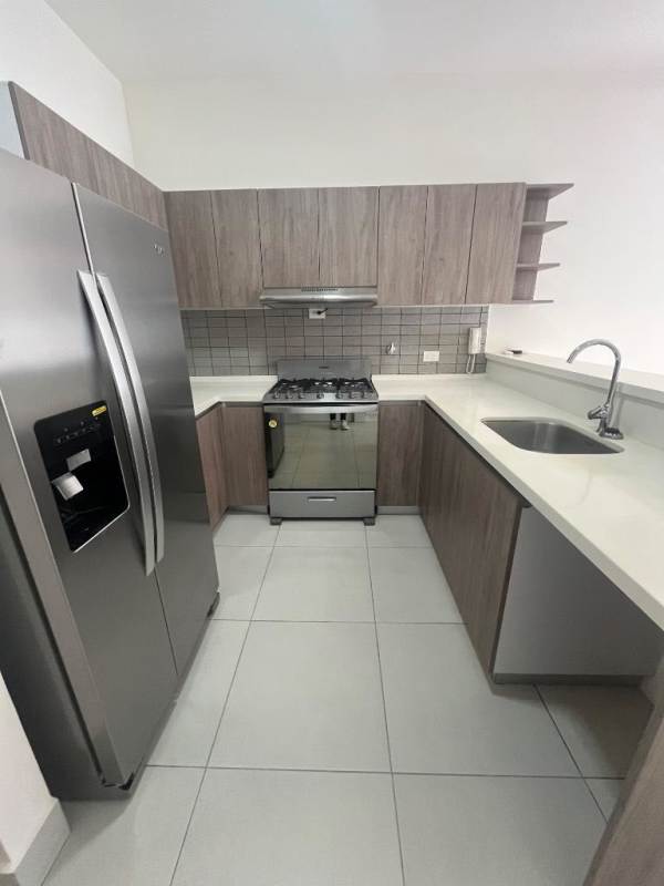 Contemporary kitchen with stainless steel appliances granite counters PH Coco Place Panama City