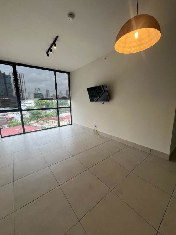 Bright living room with floor-to-ceiling windows city views at PH Coco Place Coco del Mar Panama