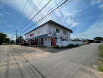 Corner lot with two-story building and signage Aguadulce Panama