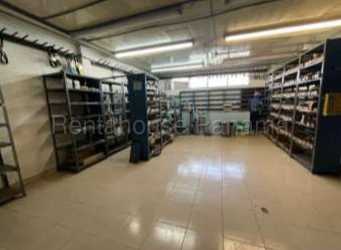 Large storage room with industrial metal shelves inside warehouse Panama