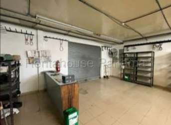 Interior of spacious garage workshop area with shelving Aguadulce Panama
