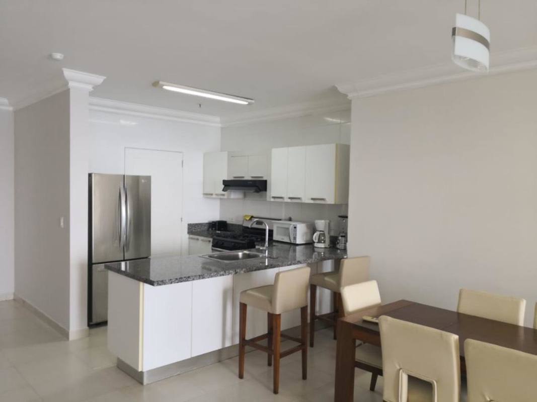 Balcony with glass railing overlooking the Pacific Ocean and city skyline at PH Waters Avenida Balboa Panama