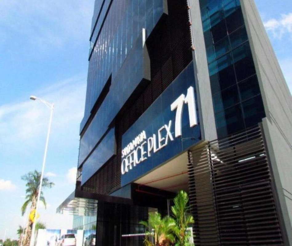 Modern glass facade of Santa Maria Office Plex business tower in Panama City