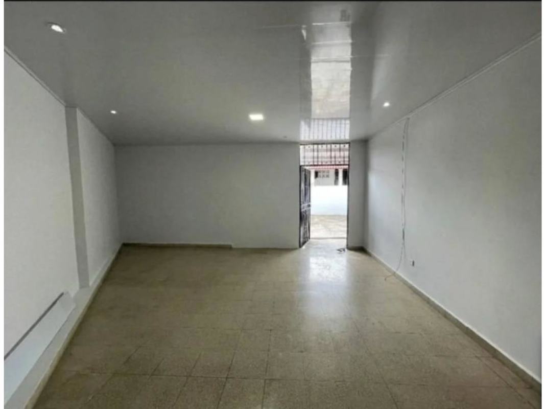 Galley kitchen with stone countertop black cabinetry in Panama City Cerro Viento