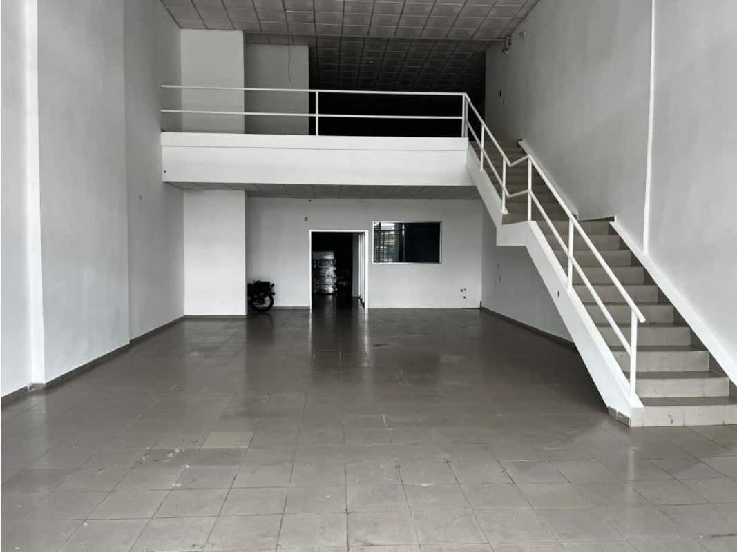 Empty interior double-height commercial space with mezzanine and tiled floor Av Domingo Díaz Juan Díaz Panama