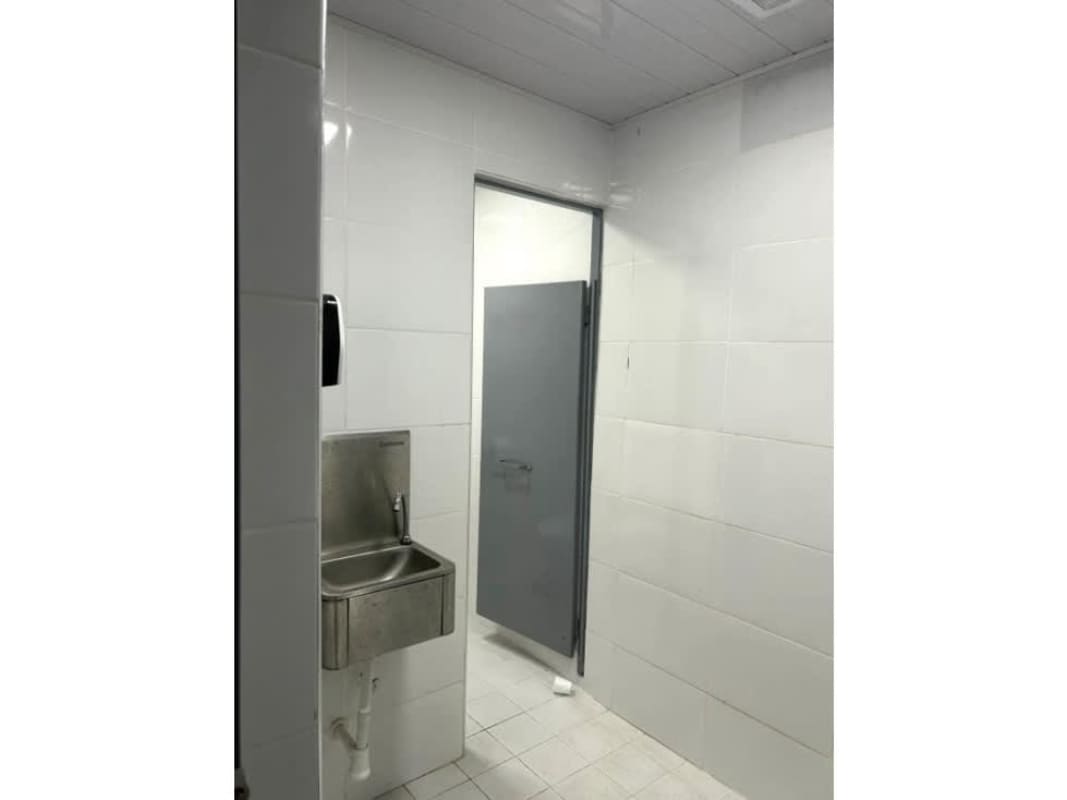 Warehouse compound entrance with security booth and large gates Rio Abajo Panama