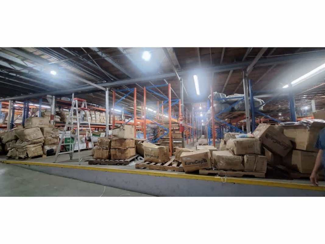 Warehouse exterior with spacious parking lot, ramp and loading dock area in Betania Panama City