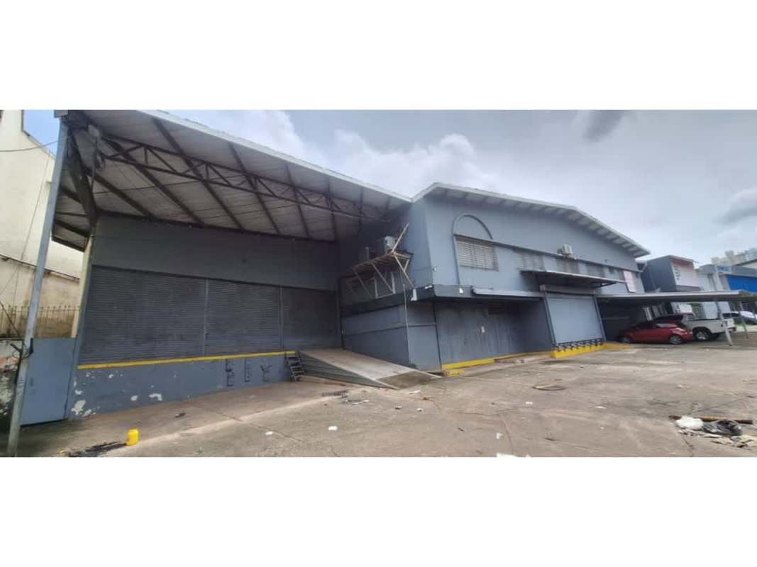 Warehouse interior featuring office partition area and high industrial roof in Panama City