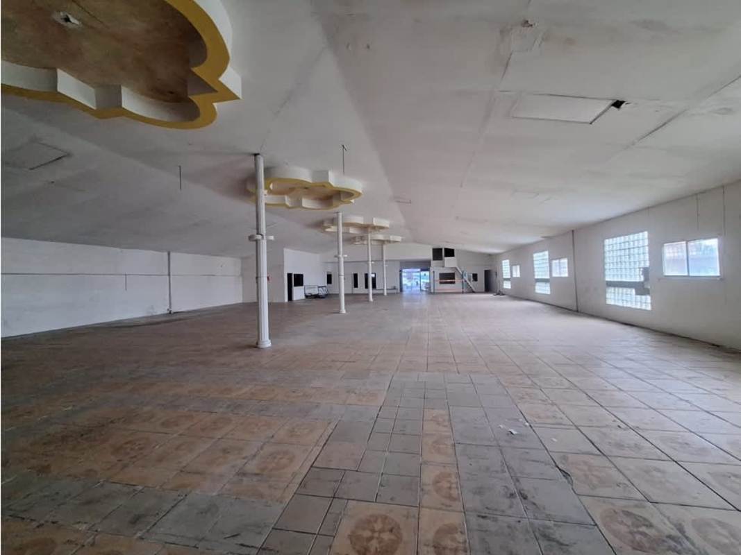 Empty commercial hall interior with decorative ceiling glass block windows Rio Abajo Panama