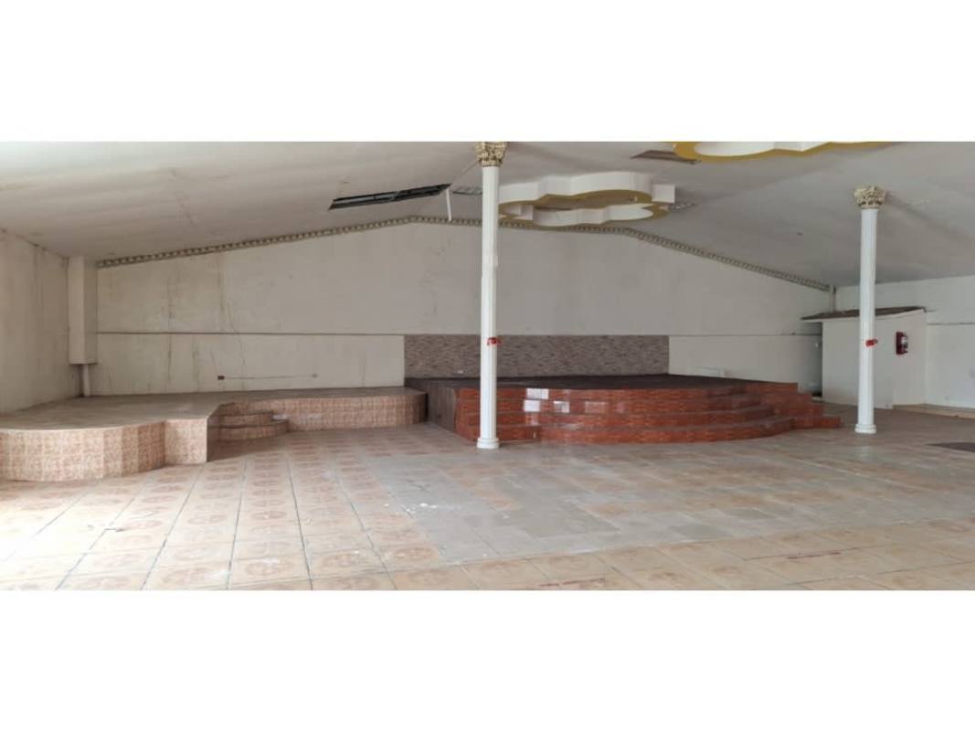 Spacious event hall with two stages white columns gold accents tiled floor Rio Abajo Panama