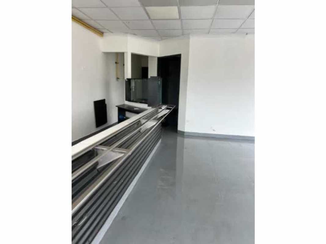 Interior of vacant commercial unit with ceramic tiles and large storefront windows Llano Bonito