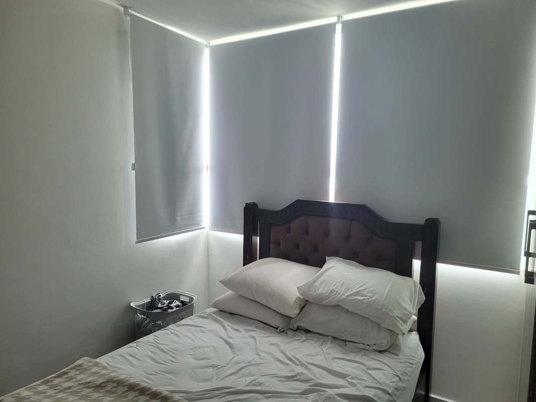 Bedroom with natural light and city view in PH Edison Park Panama City