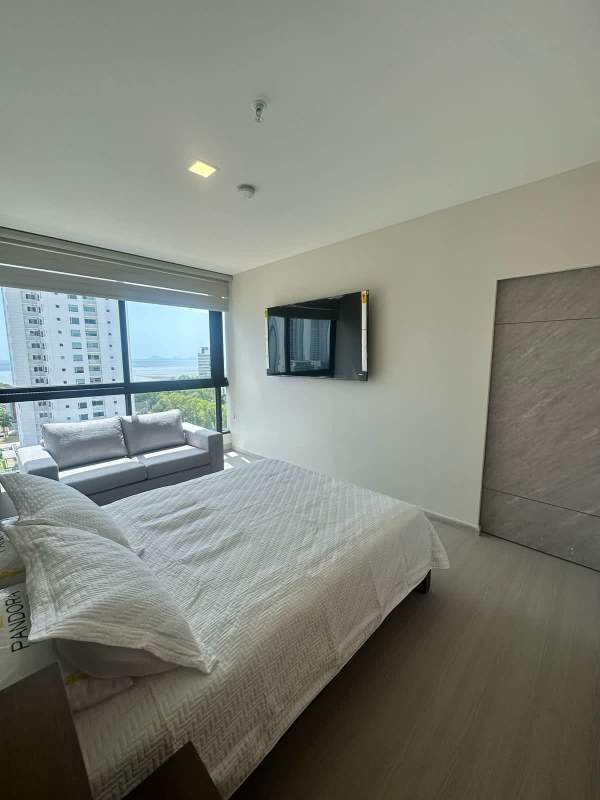Bedroom with large window city and ocean sunset views furnished PH Costa del Este Tower Panama