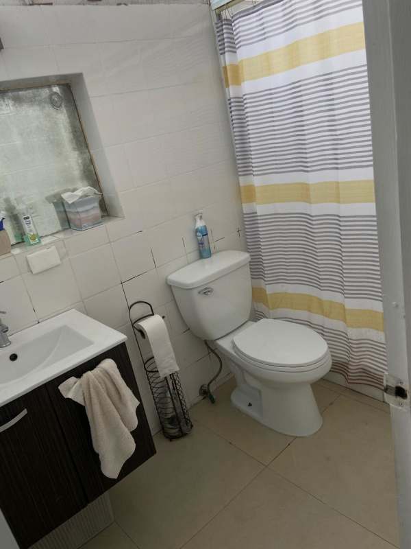 Laundry area with washer dryer hookups storage sink in PH Las Perlas apartment Panama