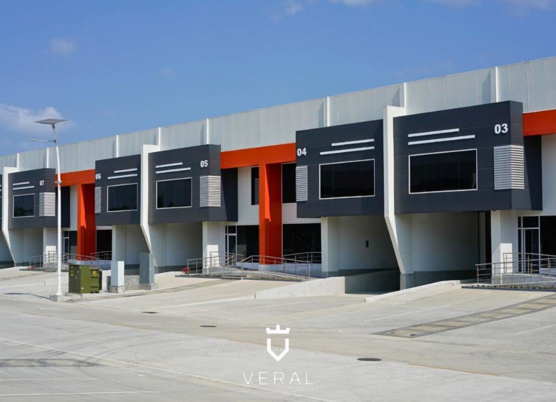 Contemporary industrial warehouse with multiple docks and orange accents in Panapark Free Zone Panama