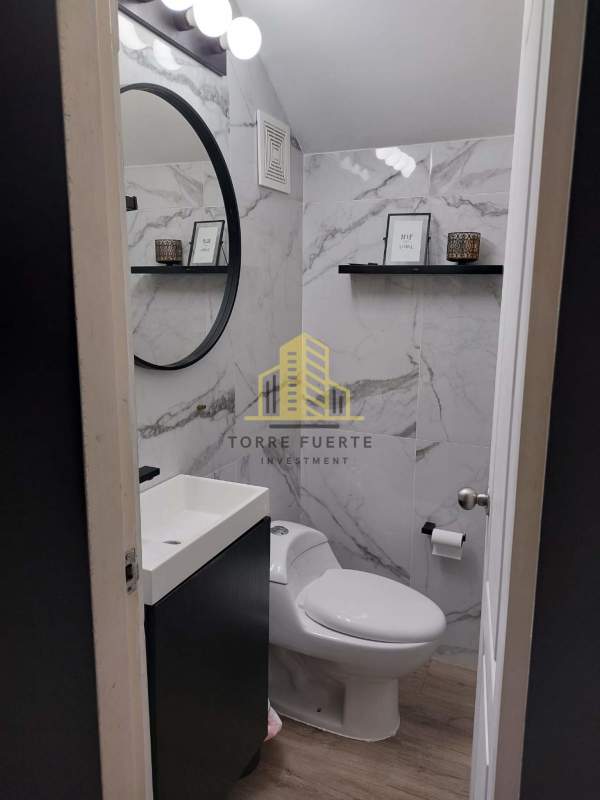 Contemporary marble tiled bathroom in Villa Lucre remodeled house for sale in Panama