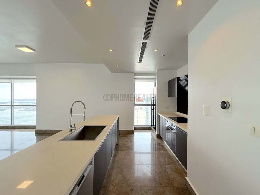 Spacious living dining open floorplan with floor-to-ceiling panoramic windows at PH Yoo Panama