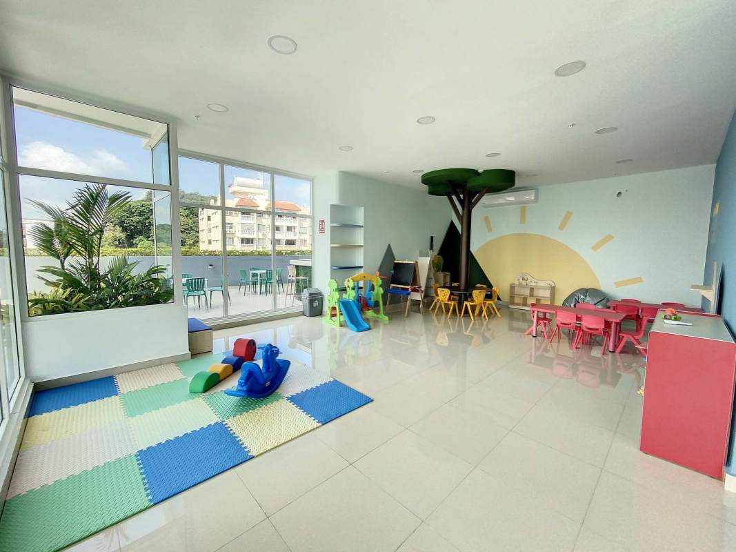 Colorful indoor kids playground with mural and toys in PH Botánico