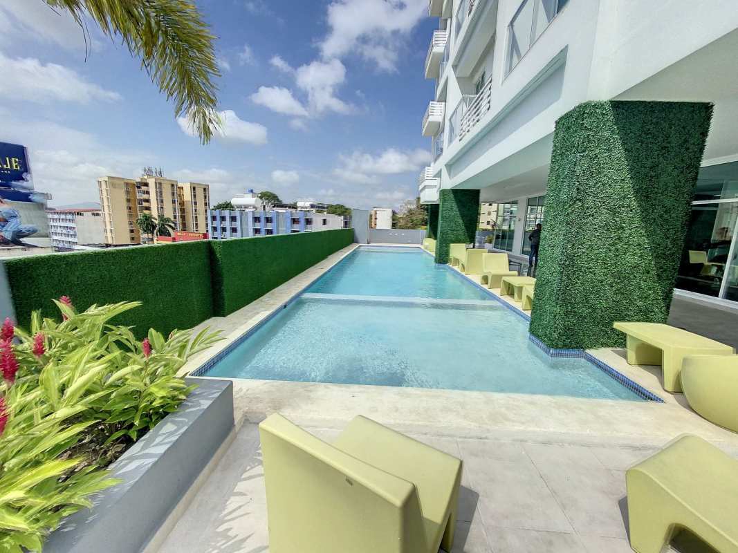 Modern rooftop pool and solarium with city views at PH Botánico