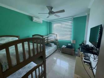 Modern kitchen with white cabinets, stainless appliances and large window Bijao Panama