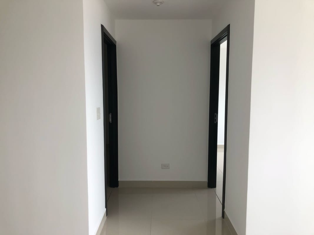 Entrance of PH Casa Gálvez tower with glass doors at Calidonia Panama