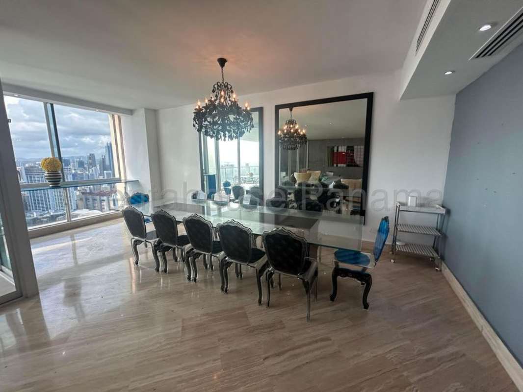 Elegant dining space with floor-to-ceiling windows overlooking Panama skyline