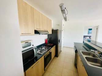 Bright furnished living room opening to terrace at PH Rodman Bijao Panama