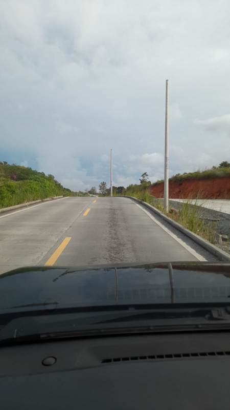 Paved access road adjacent to commercial lot with street lights greenery and development potential Las Cumbres Panama