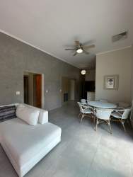 Bedroom with large window, AC, closet, ensuite bath at Bijao Beach Resort in Panama