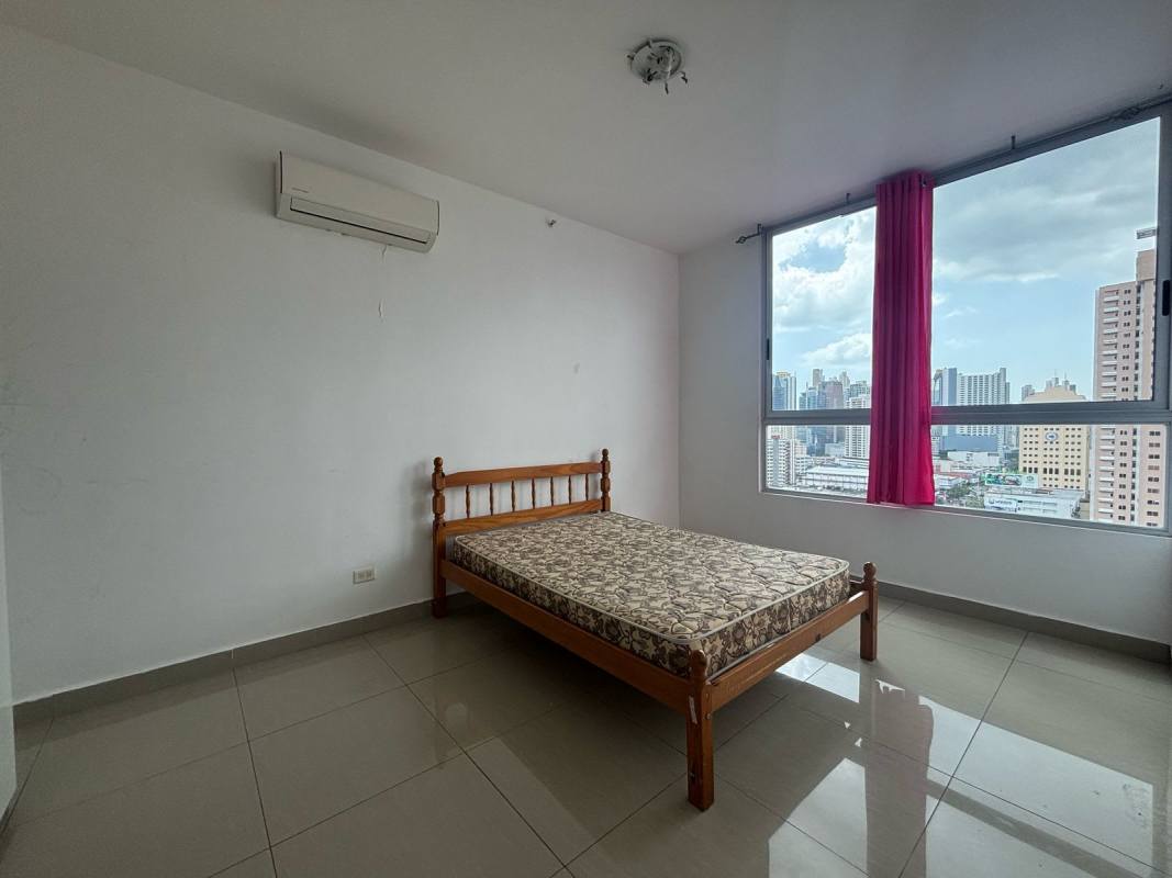 Rooftop pool with loungers and city skyline view at PH Rainbow Tower Panama