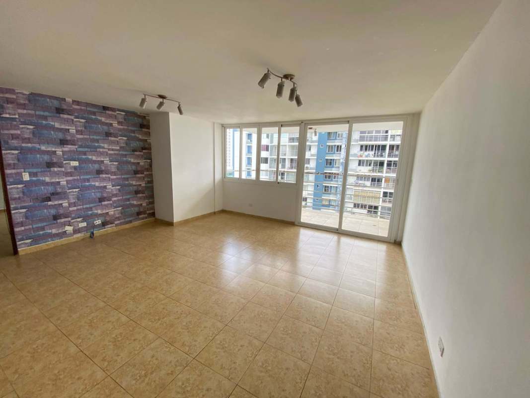 Open living dining area with balcony access and accent wall PH Cosmopolitan Towers