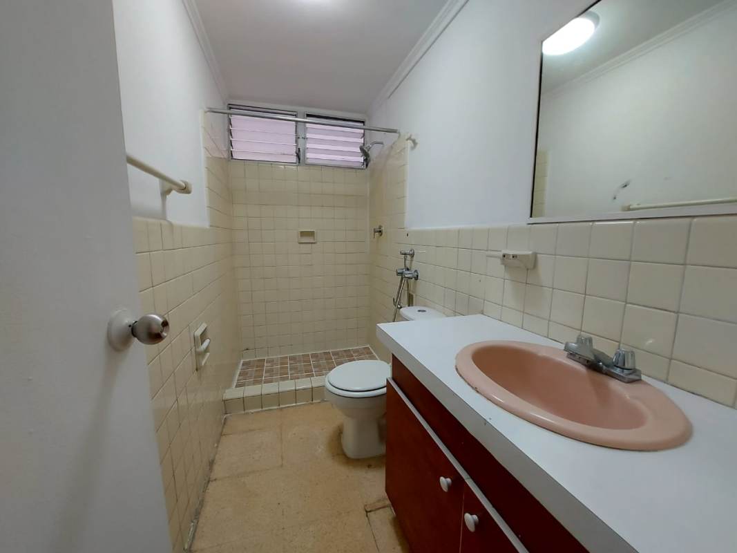 Bathroom with walk-in shower, mirror, and vanity in PH El Cangrejo Classic Panama
