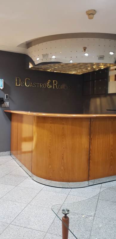 Reception lobby with curved wood desk metallic ceiling Scotia Plaza Bella Vista